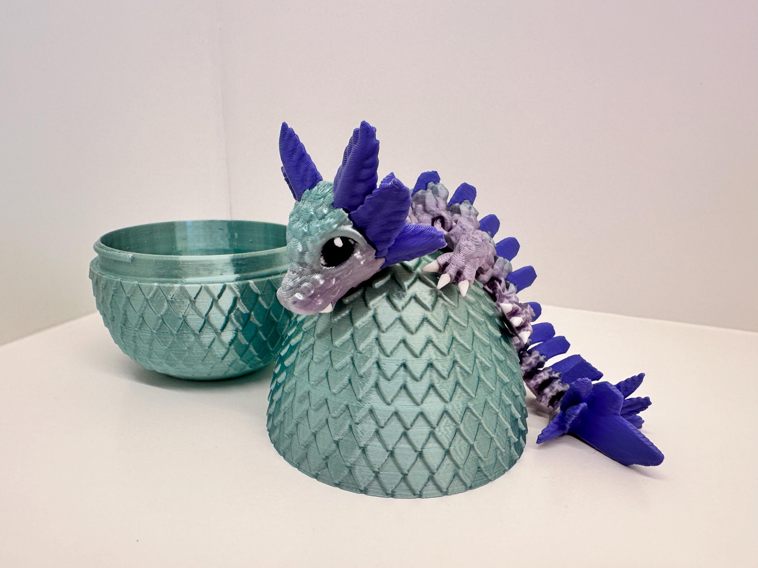 Schattig scharnierend baby speelgoed draak met ei