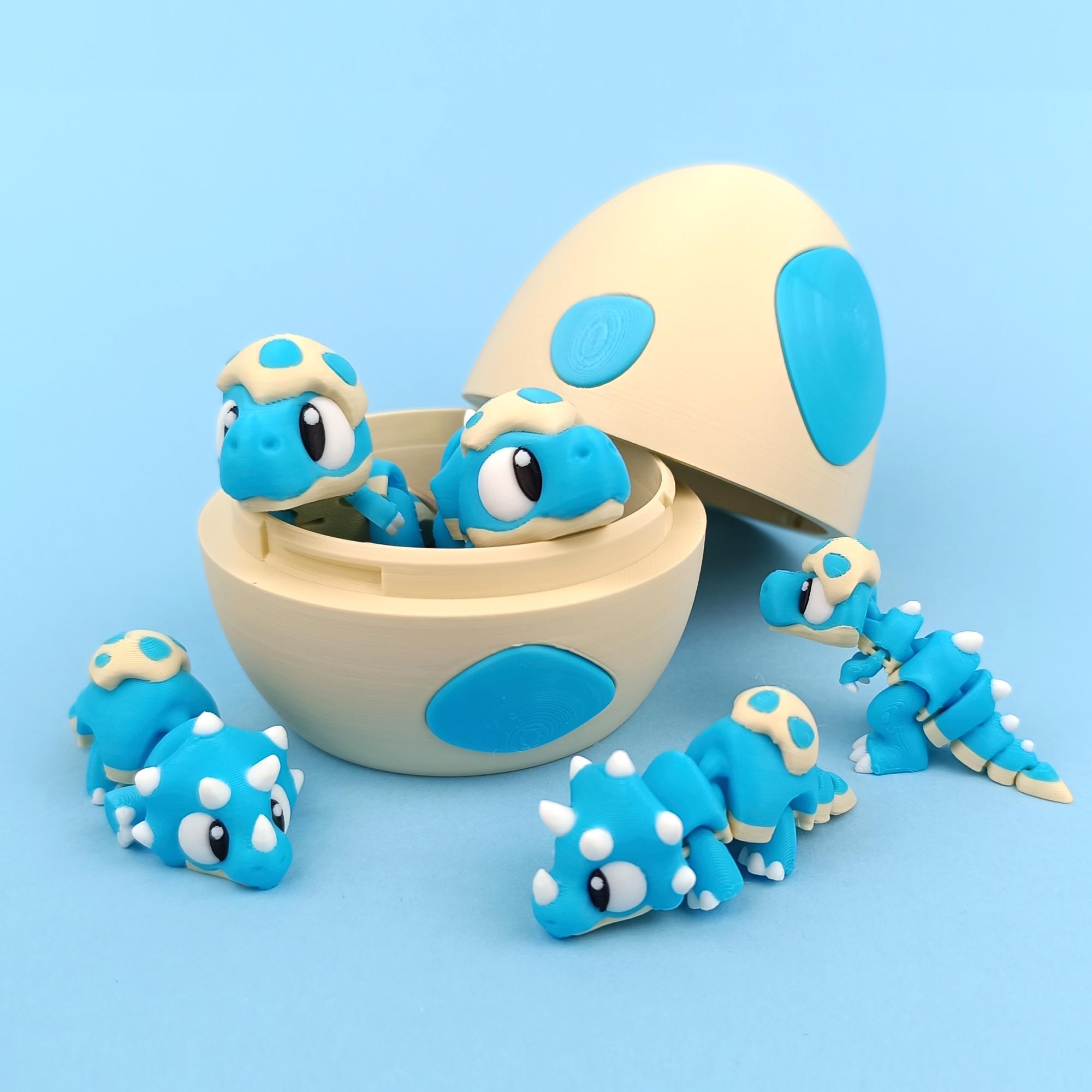 Schattige scharnierende baby dino’s met dino ei